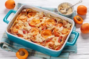 Recette de clafoutis aux abricots avec des amandes effilées en décoration